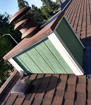 chimney Restored chimney with green siding