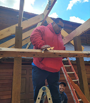 new-roof Two contractors building a new roof