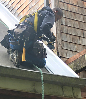 repairs Man repairing a roof