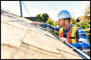 Man inspecting a roof
