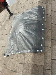 Tarp on roof